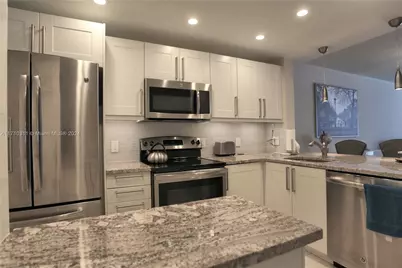 470 Paradise Isle Blvd #107, Hallandale Beach, FL 33009 - Photo 1