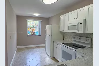 8781 Wiles Rd #108, Coral Springs, FL 33067 - Photo 9