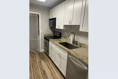 303 Racquet Club Rd #106, Weston, FL 33326 - Photo 1