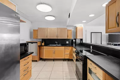 401 Golden Isles Dr #304, Hallandale Beach, FL 33009 - Photo 15