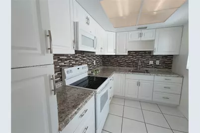 450 Golden Isles Dr #2B, Hallandale Beach, FL 33009 - Photo 5