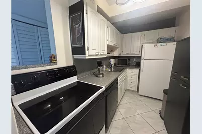 121 Golden Isles Dr #104, Hallandale Beach, FL 33009 - Photo 9