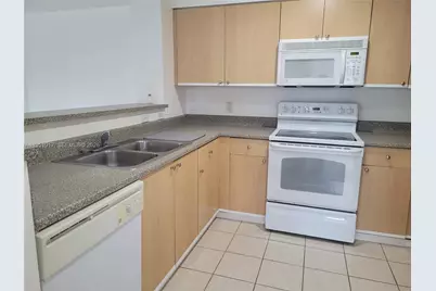 7910 N Nob Hill Rd #105, Tamarac, FL 33321 - Photo 5