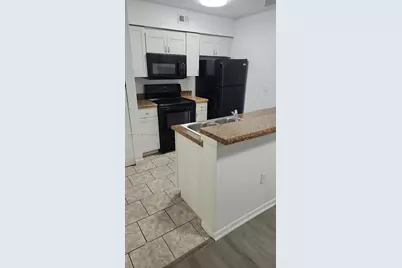 2850 N Oakland Forest Dr #103, Oakland Park, FL 33309 - Photo 1