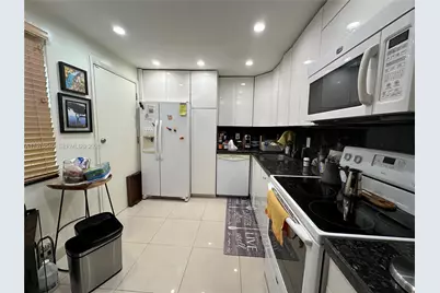 1351 NE 191st St #E107, Miami, FL 33179 - Photo 25