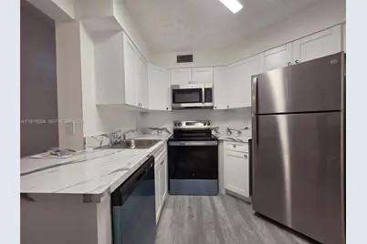 210 Lake Pointe Dr #304, Oakland Park, FL 33309 - Photo 1