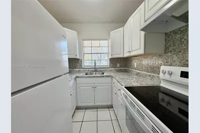 4140 Woodside Dr #107, Coral Springs, FL 33065 - Photo 1