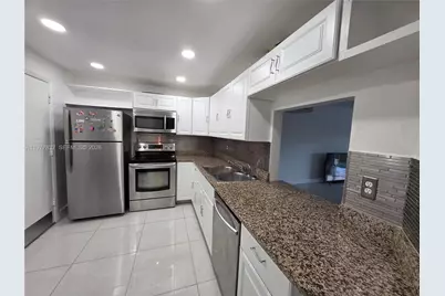 1351 NE 191st St #E420, Miami, FL 33179 - Photo 1