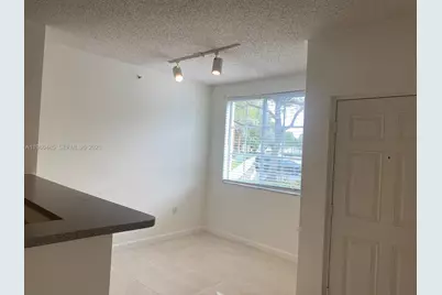 7980 N Nob Hill Rd #107, Tamarac, FL 33321 - Photo 13