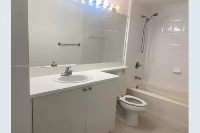 7980 N Nob Hill Rd #107, Tamarac, FL 33321 - Photo 9