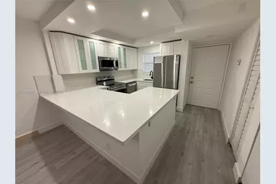 11477 NW 39th Ct #104-1, Coral Springs, FL 33065 - Photo 1