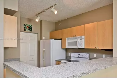 8000 N Nob Hill Rd #107, Tamarac, FL 33321 - Photo 3