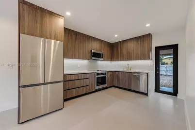 1017 NW 47th St, Miami, FL 33127 - Photo 7