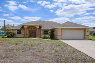 825 Costa Pl, Lehigh Acres, FL 33972 - Photo 1