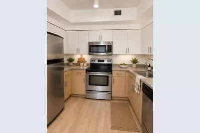 7930 N Nob Hill Rd #106, Tamarac, FL 33321 - Photo 1