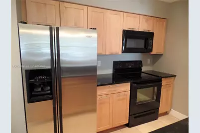 2881 N Oakland Forest Dr #112, Oakland Park, FL 33309 - Photo 1