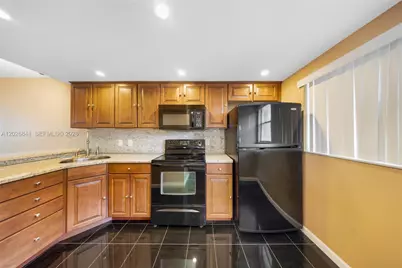 6075 N Sabal Palm Blvd #210, Tamarac, FL 33319 - Photo 1