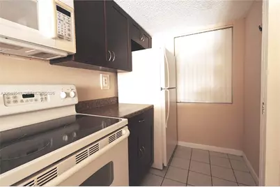 9915 W Okeechobee Rd #2-404, Hialeah Gardens, FL 33016 - Photo 13