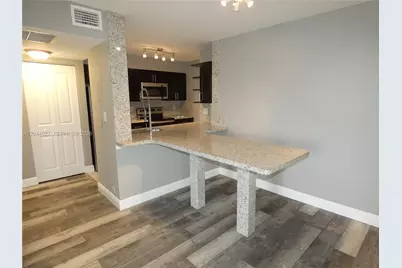 2831 N Oakland Forest Dr #101, Oakland Park, FL 33309 - Photo 1