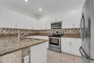 582 NE 207th St, Miami, FL 33179 - Photo 13