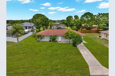 909 Sally Ave NE, Lehigh Acres, FL 33971 - Photo 3