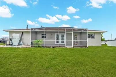 909 Sally Ave NE, Lehigh Acres, FL 33971 - Photo 9