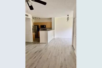 8010 N Nob Hill Rd #102, Tamarac, FL 33321 - Photo 7
