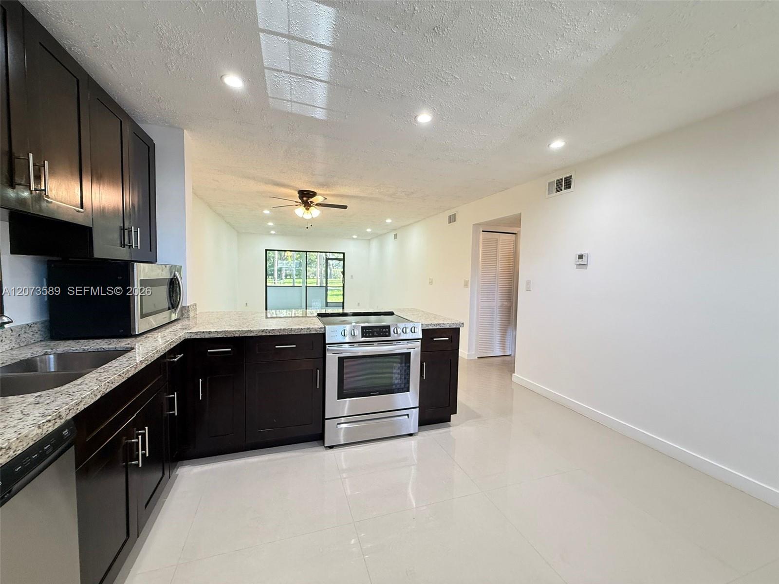 6095 N Sabal Palm Blvd #103 - 6095 N Sabal Palm Blvd #103, Tamarac, FL 33319 Luxury Property | Jose Angel Pina