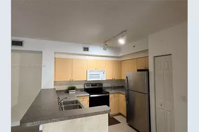 8030 N Nob Hill Rd #105, Tamarac, FL 33321 - Photo 7