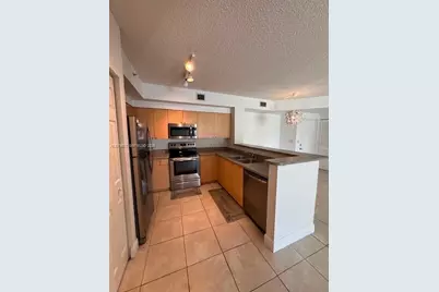 7920 N Nob Hill Rd #103, Tamarac, FL 33321 - Photo 11