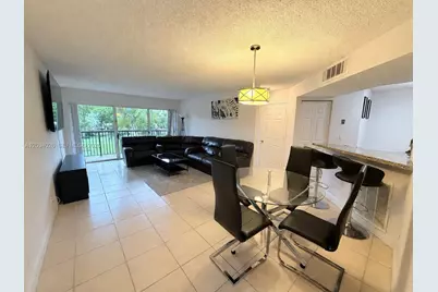 8741 Wiles Rd #204, Coral Springs, FL 33067 - Photo 1