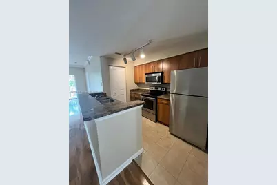 5940 W Sample Rd #304, Coral Springs, FL 33067 - Photo 11
