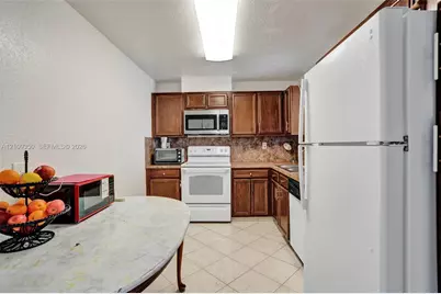 10777 W Sample Rd #616, Coral Springs, FL 33065 - Photo 13