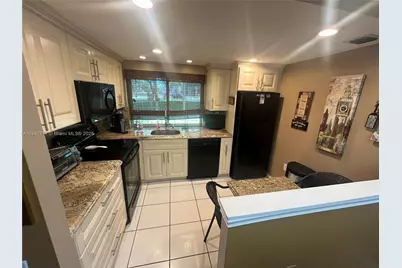 9351 Lime Bay Blvd #101, Tamarac, FL 33321 - Photo 1