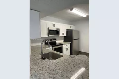 8701 Wiles Rd #103, Coral Springs, FL 33067 - Photo 1