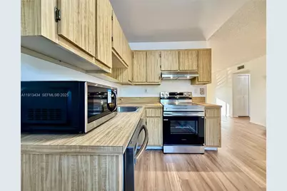 313 Gardens Dr #203, Pompano Beach, FL 33069 - Photo 1