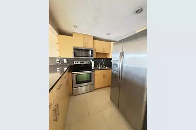 6095 W 19th Ave #407, Hialeah, FL 33012 - Photo 1