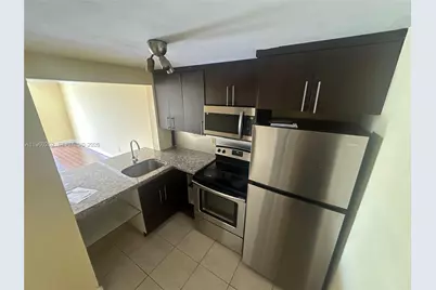 496 NW 165th St Rd #D-311, Miami, FL 33169 - Photo 1