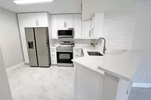 9055 Wiles Rd, Coral Springs, FL 33067 - Photo 5