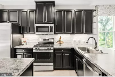 112 Spring Gate Lane #CLARENDON-MIDLEVEL, Pasadena, MD 21122 - Photo 1